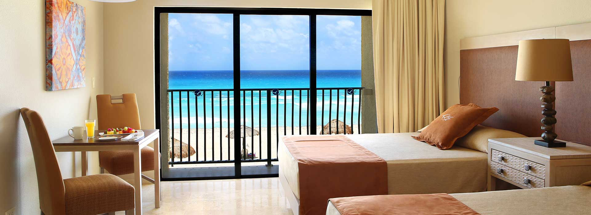 Beachfront Junior suite with ample seating area by the Mexican Caribbean Sea